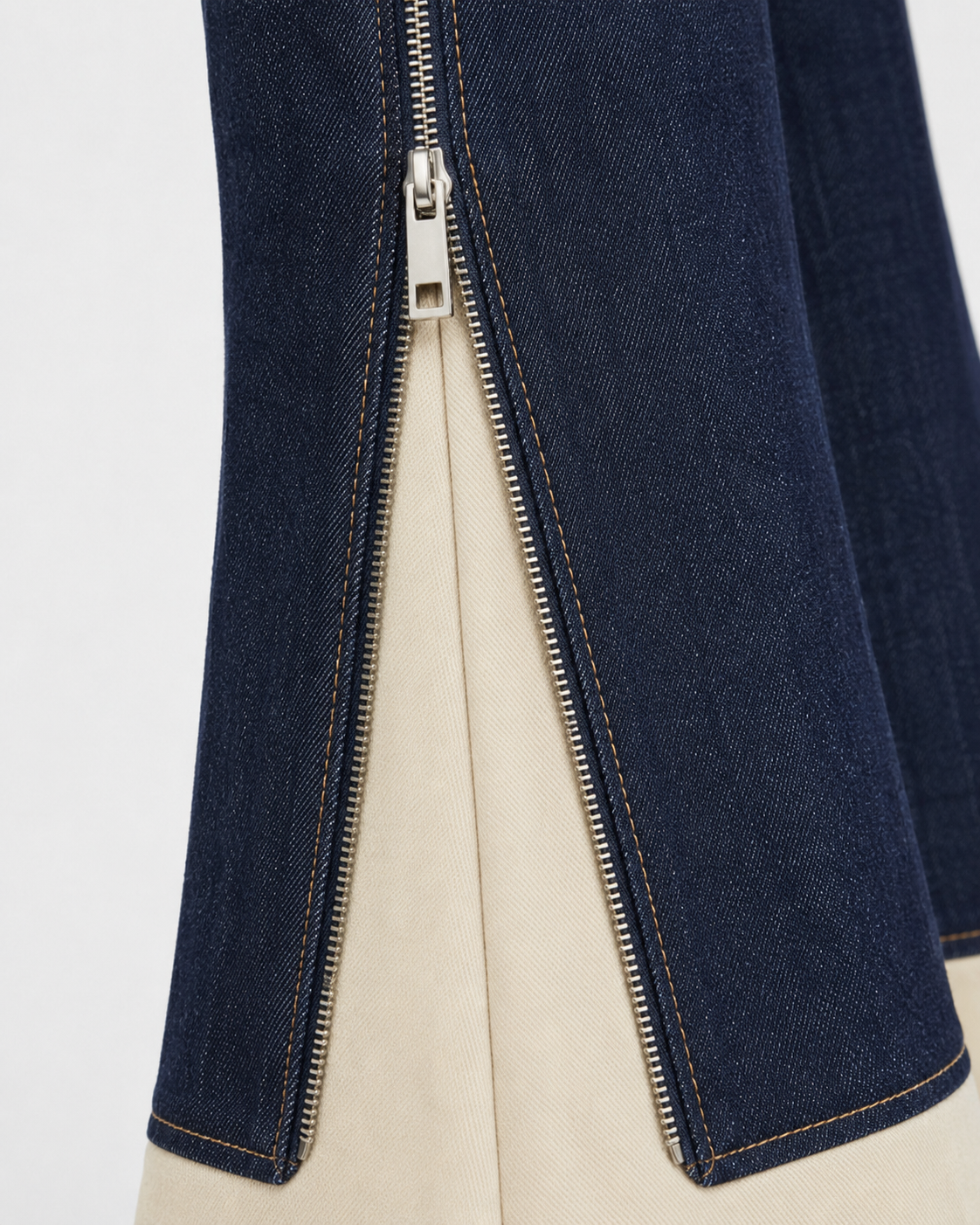 Melato Nuit Blanche Zip Flare Jean detail shot — exposed zipper denim
