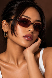 Model Y.M. is featured wearing the Melato Tinted Testimony sunglasses.