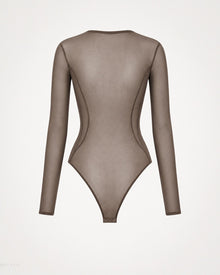 Back view of the Melato Body Language Cocoa Mesh Bodysuit with sheer cocoa fabric, long sleeves, curved contour seam lines, and bottom snap closure.