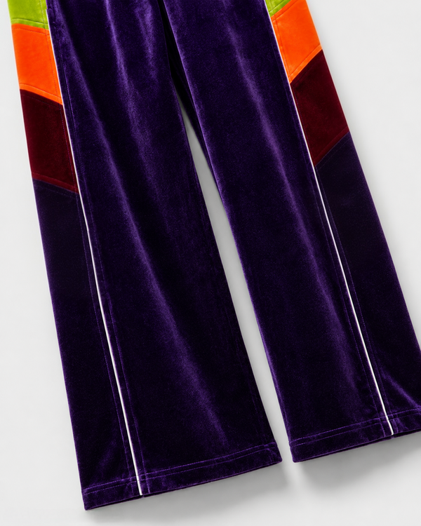 Melato Conquista Velour Track Pant detail shot — premium velour paneling