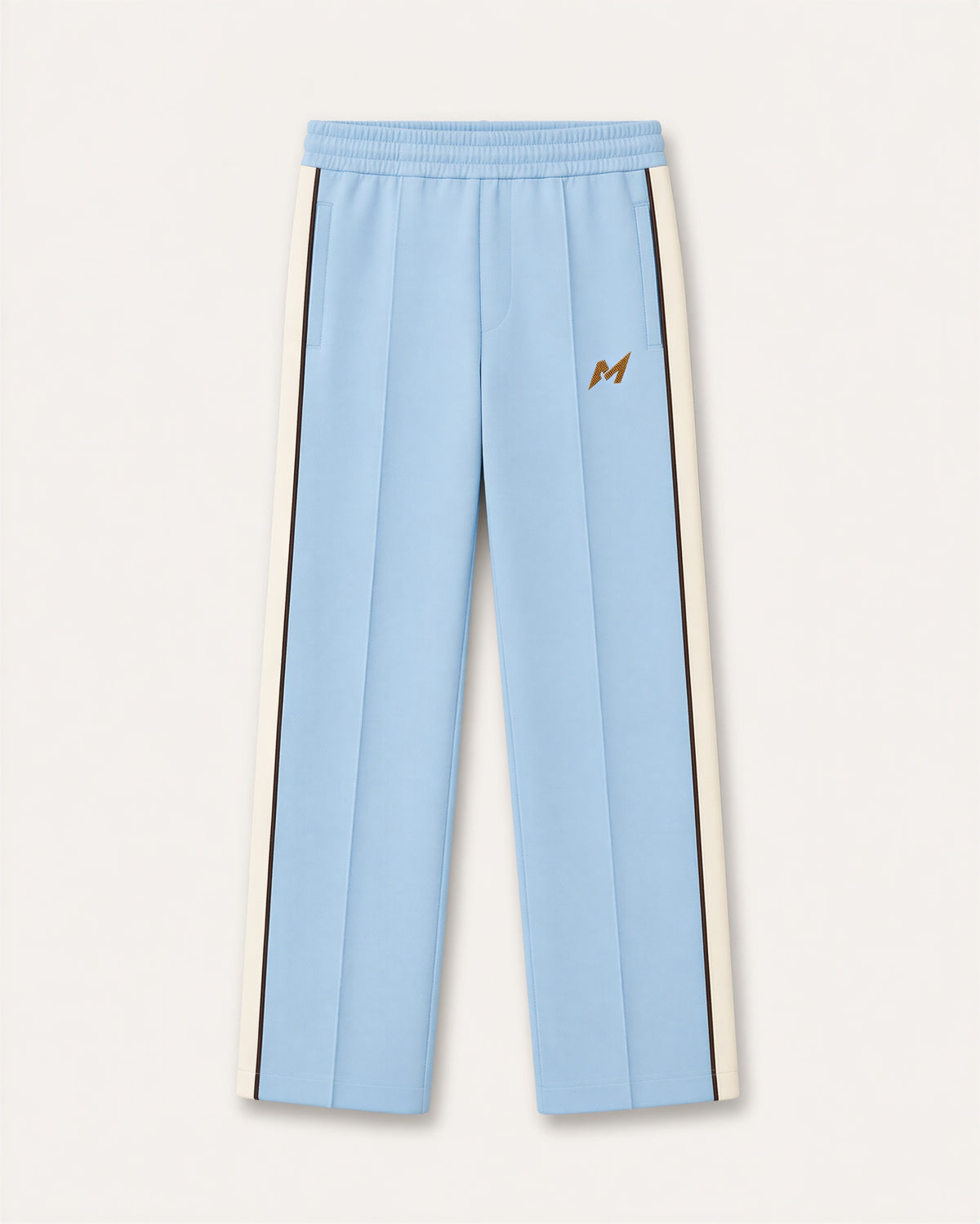 Reasonable Doubt Track Pant in powder blue with wide ivory side bands, dark brown piping and gold upper-leg emblem