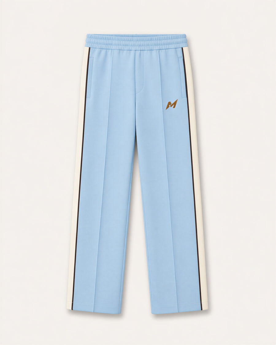 Reasonable Doubt Track Pant in powder blue with wide ivory side bands, dark brown piping and gold upper-leg emblem