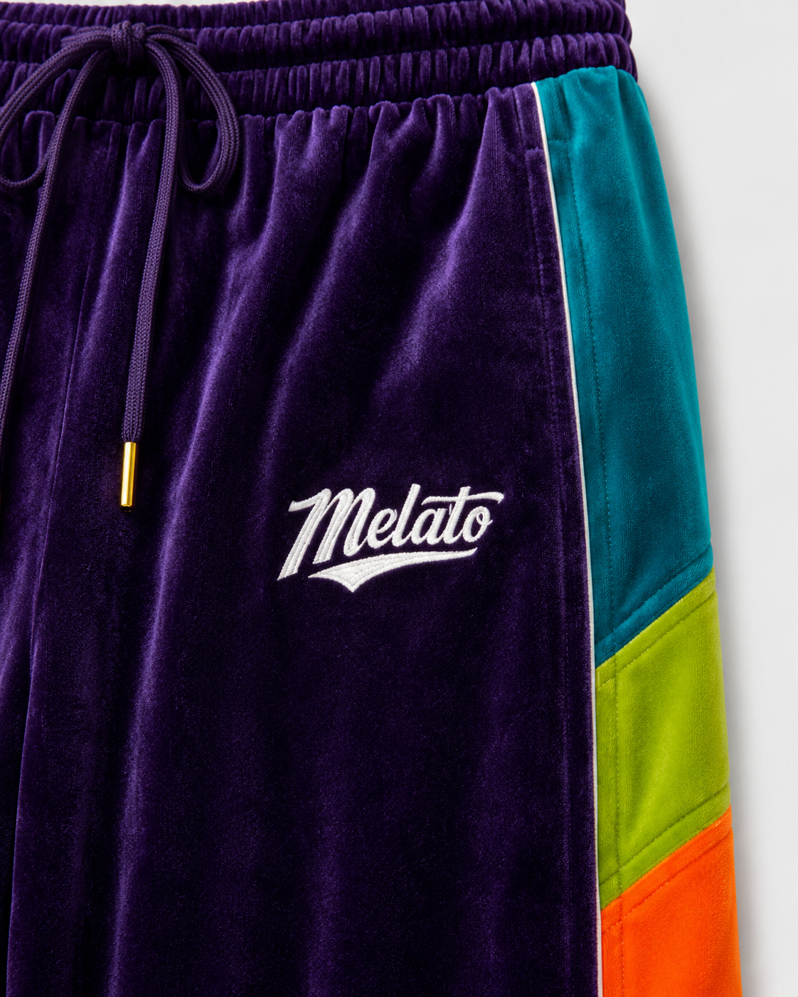 Melato Conquista Velour Track Pant side view — colorblock velour track pants