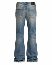 Melato Hendrix Distressed Flare Jean detail shot — distressed denim texture