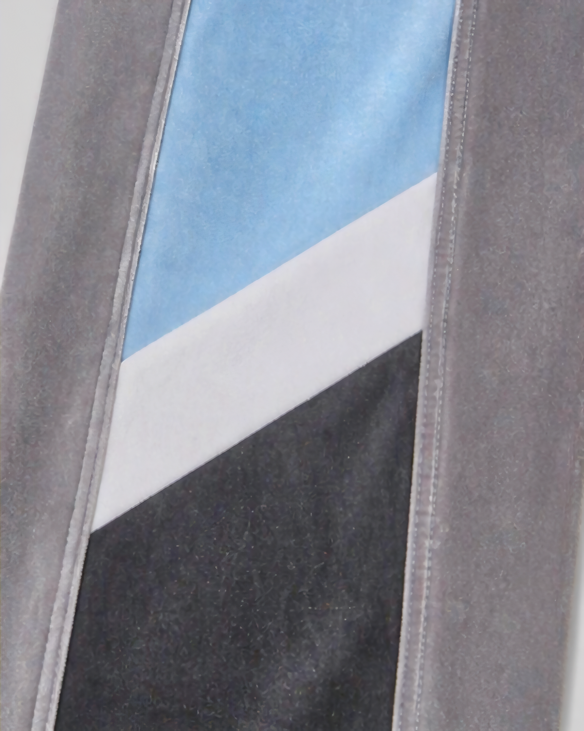Melato Chū Velour Track Pant detail view — geometric velour paneling