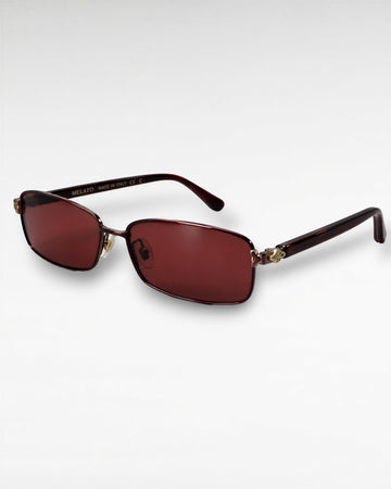Tinted Testimony maroon metal sunglasses with red nylon lenses front three-quarter view