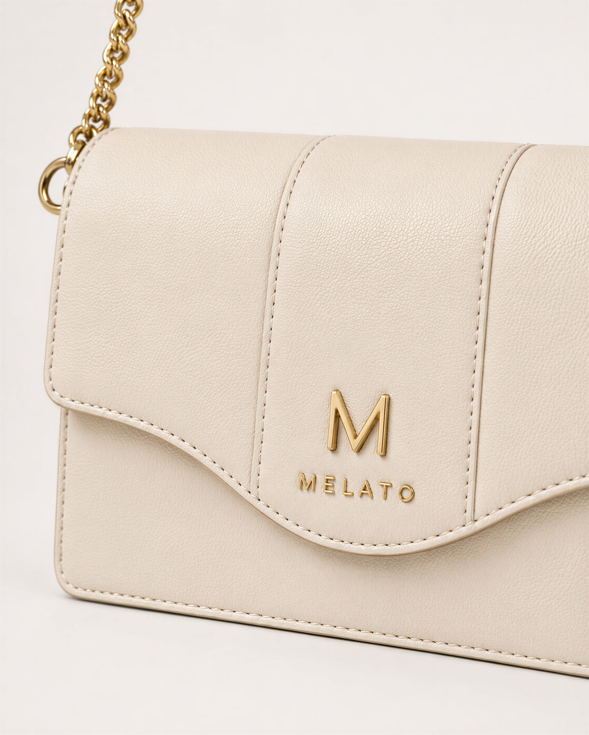 Return to Sender ivory chain wallet with detachable gold-tone chain strap