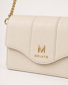 Return to Sender ivory chain wallet with detachable gold-tone chain strap