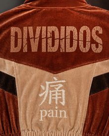Melato Passion Fruit Velour Track Jacket detail shot — plush velour texture